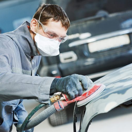 Auto Repairman Grinding Autobody Bonnet